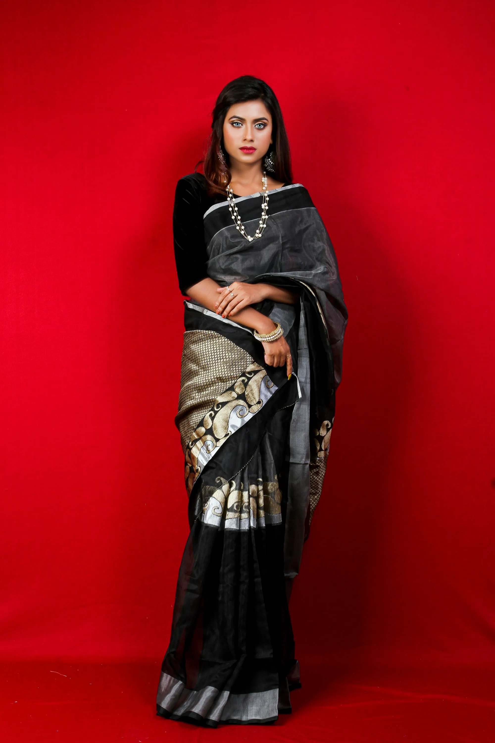 Saree detail against red wall