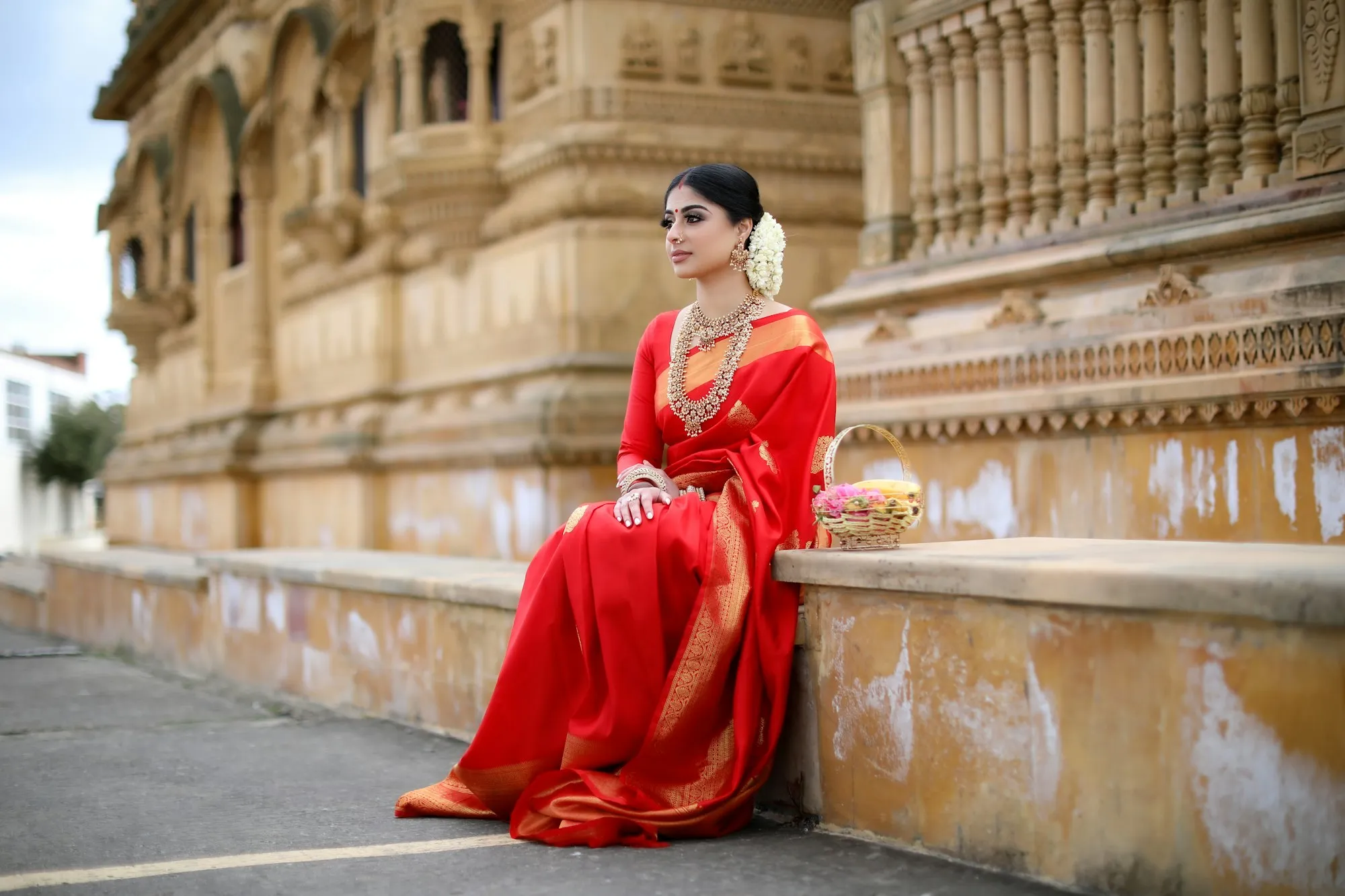 Woman in a red handloom saree